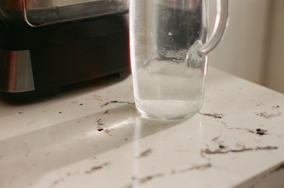 A clear pitcher staged on a kitchen counter for a simple cold-drink setup.