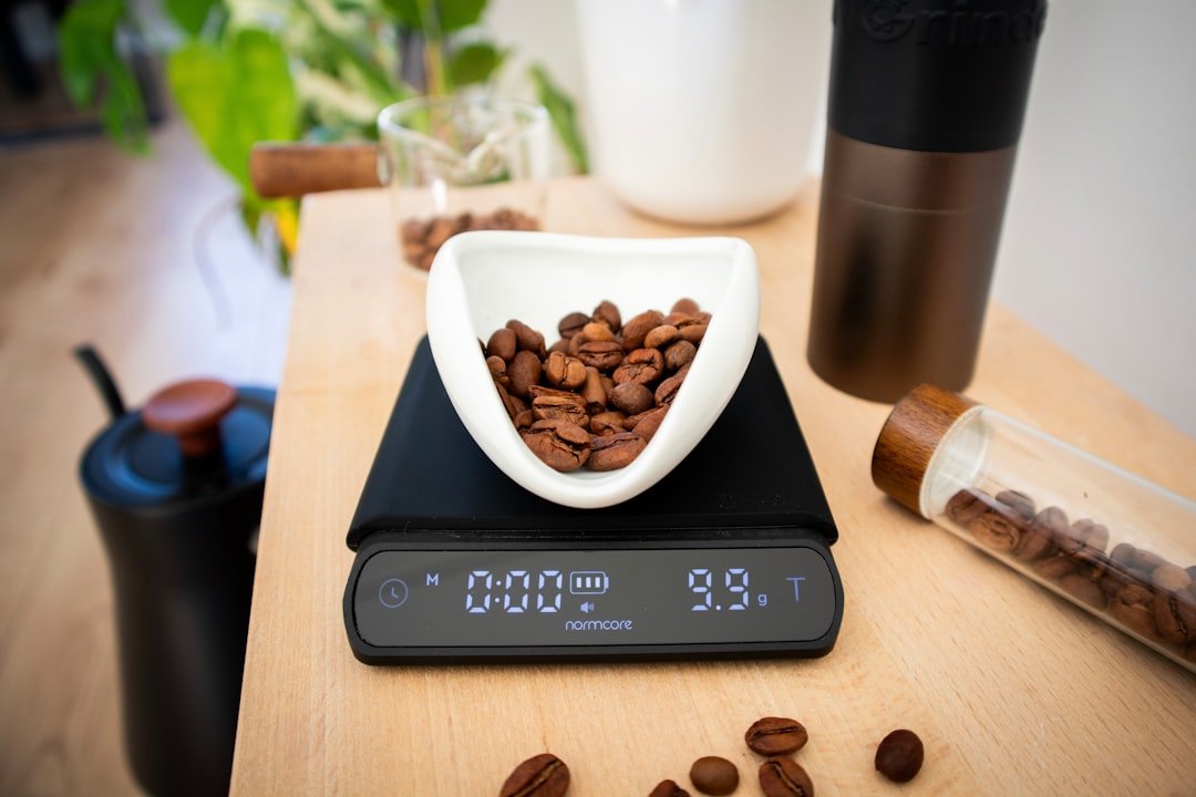 Coffee beans are being weighed on a digital scale