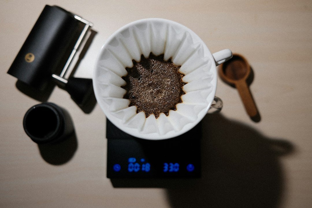 a cup of coffee sitting on top of a scale