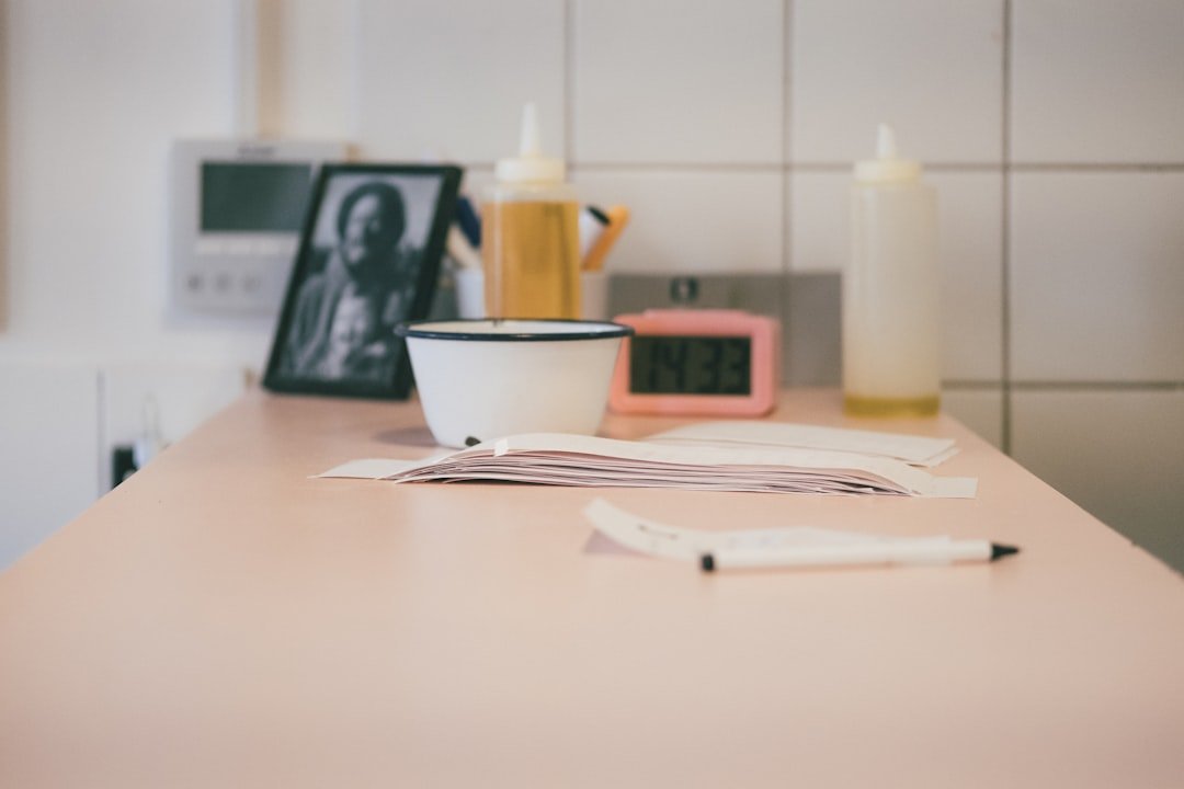 White cup and saucer tucked under a small shelf.